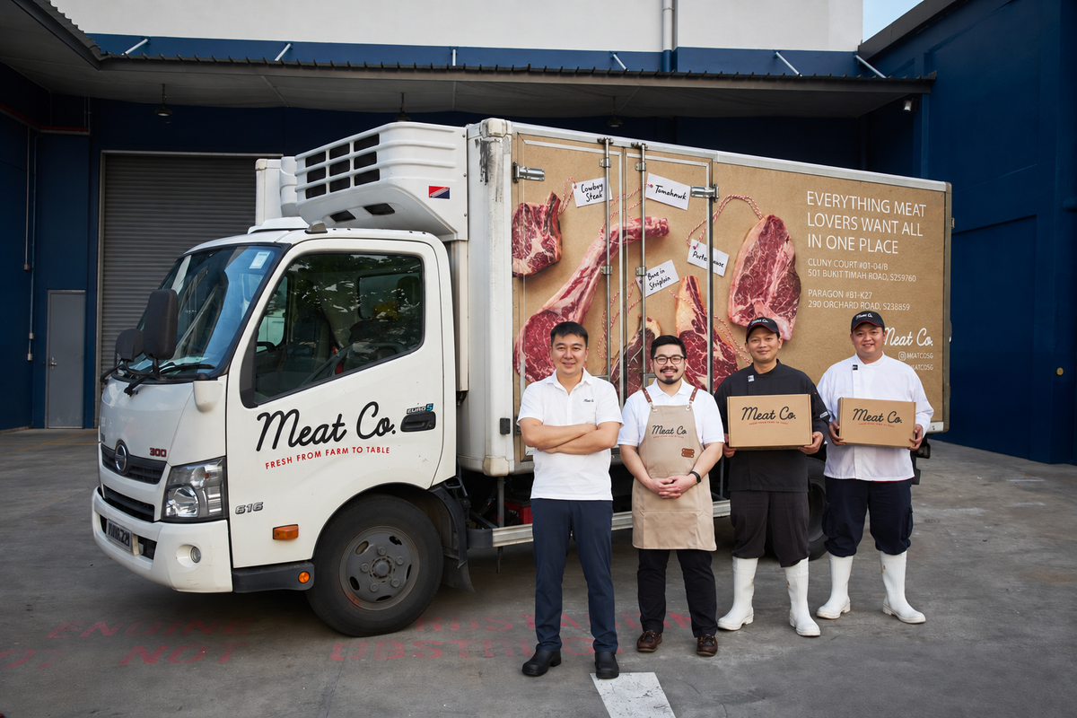 Meat Co. team with refrigerated delivery truck